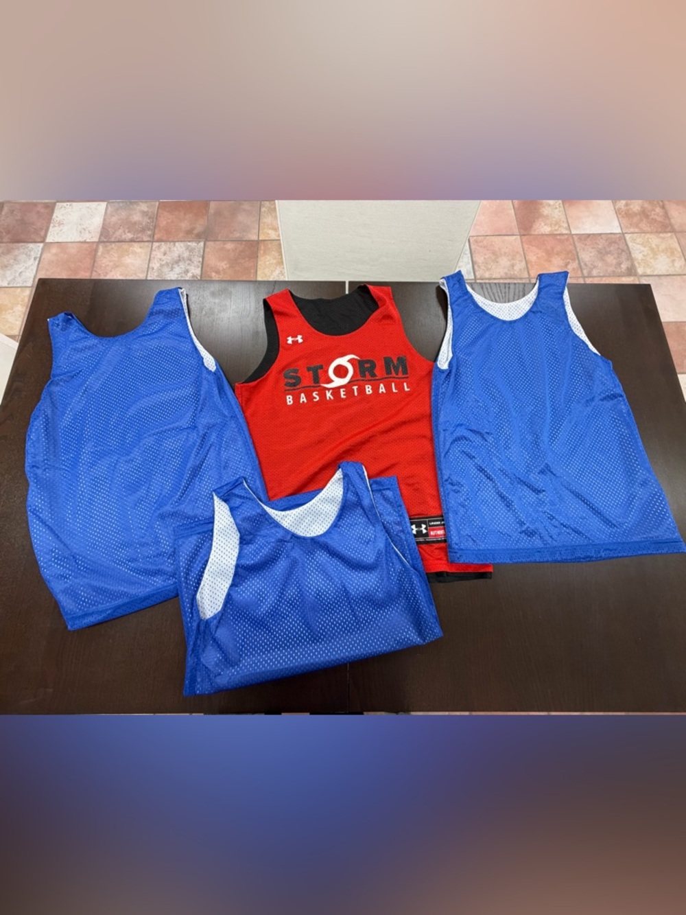 Four youth medium reversible basketball jerseys
